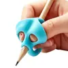 Corrector de agarre de lápiz para estudiantes de preescolar y primaria para corregir el agarre del lápiz y la postura de escritura