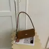 Bolsa de ombro retrô estilo coreano transfronteiriça, nova bolsa baguette de nicho estilo francês, bolsa de ombro casual da moda para mulheres