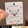 Conjunto de brincos de três peças estilo francês minimalista, formato gatinho, com pedra de trevo de quatro folhas, para mulheres, requintado, pequeno, versátil e deslumbrante - atacado