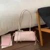 Bolsa fresca e simples feminina 2026 novo estilo moda nicho bolsa de mão para trabalho trajeto bolsa de ombro única bolsa doce de axila