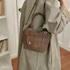 Bolso de hombro versátil, diseño simple, bolso tipo cubo con patrón de diamantes para mujer, estilo nicho, bolso cruzado 2026, nuevo estilo retro de moda