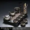 Juego de té de arcilla púrpura con diseño de bambú dorado, que incluye una tetera y tazas de servicio para uso doméstico, con un asa para prevenir quemaduras y asegurar la distribución uniforme del té