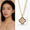 Colgante de Cruz de Nácar con Trébol de Cuatro Hojas de Circonita Micropavimentada Lujo Ligero Nicho Accesorio de Collar Versátil para Mujeres Joyería de Verano
