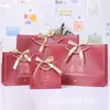 Novos Sacos de Presente Festivos em Vermelho Chinês, Sacolas de Mão para Celebrações, Lembrancinhas de Aniversário, Sacos de Doces, Sacos de Papel com Fitas