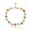 Venta Caliente Transfronteriza Nuevo Producto Pulsera Francesa Lujo Ligero Gama Alta Completamente Incrustada con Diamantes Circonita Pulsera de Trébol de Cuatro Hojas Siete Colores Joyería de Acero de Titanio