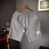 Shorts masculinos de verão novos estilo japonês masculinos modernos soltos casuais shorts da moda esportiva com etiqueta calças de praia