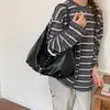 Bolsas de alta gama de nicho para mujer Otoño/Invierno 2026 Nuevo Bolso de Hombro Único Cruzado Versátil Retro Bolso de Axila de Trabajo Tipo Empanada