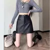 Falda de cuero marrón, nueva falda corta de PU de cintura alta adelgazante para mujer de otoño e invierno, falda bodycon de línea A petite