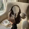 Bolso de mano pequeño de moda con estampado de lichi transfronterizo para mujer, nueva colección 2026, bolso tote para el trabajo, bolso tipo cubo, bolso cruzado moderno y elegante