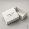 Venta al por mayor de empaques personalizados de alta gama, fabricación de cajas blancas, ventas directas de fábrica de ropa, pedidos personalizados basados en dibujos, productos en stock de la fábrica fuente