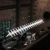 Lámpara de banco larga de diseño posmoderno para cafeterías y bistrós, creando una atmósfera única y creativa para las mesas de comedor de restaurantes