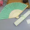 Comercio electrónico transfronterizo abanico femenino elegante más vendido 21cm abanico de boda abanico femenino caja hueca 14 colores opcionales