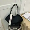 Bolso de hombro tejido con patrón transfronterizo para mujer, nuevo bolso de hombro de diseño de nicho de moda otoño e invierno 2026, bolso de mano popular