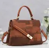 Bolso de mano único e irregular de retazos de colores vibrantes retro y moderno, bolso de mujer con solapa de jacquard de alto valor, bolso de moda