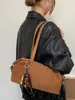 Bolso de mano retro de nicho transfronterizo para ir al trabajo, nuevo modelo de moda 2026 para mujer, bolso de hombro debajo del brazo de gamuza de gran capacidad