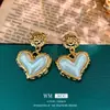 Pendientes Vintage de Segunda Mano Aguja de Plata Plisado Corazón Rojo Pendientes de Metal Pendientes Personalizados Retro Fabricante Venta al por Mayor