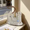 Bolso Grande de Mujer 2026 Nuevo Estilo de Nicho Hombro Único Vacaciones en la Playa Tejido de Paja Bolso Tote para el Trabajo