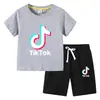 Camiseta infantil 2022 TikTok verano nueva ropa infantil de comercio exterior coreana pantalones cortos de manga corta para niños traje de dos piezas