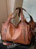 Bolsa de motocicleta genial y elegante, bolso de cuero para mujer, moda europea y americana, gran capacidad, bolso de hombro, bolso cruzado, bolso de viaje, simple y moderno