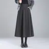 Saia Midi Espessa da Moda para o Trabalho com Barra Larga para Mulheres 2026 Outono/Inverno Novo Estilo Saia Evasê de Cintura Alta que Cobre o Quadril