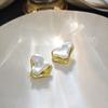 Pendientes de aguja de plata con diseño irregular de amor simple europeo y americano, dos pendientes personalizados de oro y plata con contraste de color para mujer.