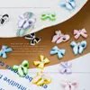 Celebridad en línea joyería para uñas lazo de cinta aleación pintura en aerosol rhinestone japonés lazo decoraciones para uñas al por mayor