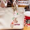Botella flotante de aceite de dibujos animados Sanrio, llavero de avión pequeño para coche, colgante lindo para mochila escolar de estudiante, regalo pequeño al por mayor