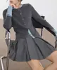 Suéter de Punto Elegante Gris de Lana de Oveja con Empalmes para Mujer Invierno 2025 Nuevo Punto Simple de Gama Alta