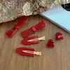 Corea del Sur Dongdaemun Francia logo dorado lindo retro vino tinto mini fleco pinza para el pelo clip lateral accesorios para el cabello sin costuras