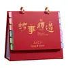 Calendario de escritorio 2027 Año del Cordero, hecho a medida, con páginas de índice coloridas, multifuncional, con un diseño simple de dibujos animados, y disponible para venta al por mayor con impresión de logotipo en lámina de oro