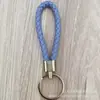 Llavero de cuerda de cuero trenzado simple creativo colgante de muñeca linda accesorios de llave para parejas tendencia regalos pequeños venta al por mayor