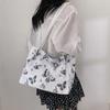 Bolso de gran capacidad, novedad de verano 2024, bolso de hombro de moda con textura de PU, bolso de mano pequeño con mariposas frescas debajo del brazo.