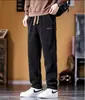 Pantalones casuales para hombre con forro polar y engrosados, pantalones de trabajo de pana para otoño e invierno, pantalones rectos para hombre con cintura elástica, venta al por mayor y hechos a medida