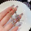 Brincos de franja de trigo da moda de luxo leve, design de nicho feminino, brincos de agulha de prata, brincos de temperamento versáteis para celebridades da internet, que afinam o rosto