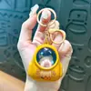 Llavero de dibujos animados creativos kappi bala de cara giratoria lindo colgante para mochila escolar llavero para llaves de coche pequeño regalo al por mayor