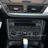 Adecuado para 11-15 BMW X1E84 panel central de control CD de fibra de carbono marco decorativo accesorios de modificación de interior de coche