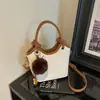 Bolso de cubo de mano Shuai Mi nuevo, estilo coreano, moderno y único, estilo simple para ir al trabajo, para mujer, bolso cruzado casual de nicho