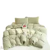 Juego de ropa de cama de cuatro piezas de terciopelo de leche con grabado ins sábana de tejido gofrado clase A funda de edredón de terciopelo coral faldón de cama textiles para el hogar juego de ropa de cama de tres piezas