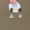 Brincos Olho de Tigre Estilo Melanoid Retro Senso de Design de Nicho Brincos Versáteis Luxo Leve Moda de Alta Qualidade Brincos de Tarraxa para Mulheres