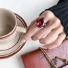 Anillo de lujo Zhuangshengsheng de cobre chapado en oro con forma de huevo de corindón de imitación, ligero y de oro negro, para mujer, 15 x 20