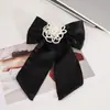 2025 Novo Estilo Presilha de Cabelo com Laço de Pérola Cetim Elegante Moda Doce Acessório de Cabelo para Meninas Atacado Atacado para Feiras