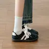 Zapatillas de entrenamiento retro de nicho alemán súper populares para mujer 2026 planas casuales de suela blanda zapatos blancos moda estudiantil modernos Zapatos Forrest Gump