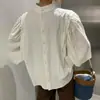 Corea del Sur chic otoño estilo francés cuello alto medio diseño de botón trasero sentido de diseño moda nicho blusa top de manga farol para mujer