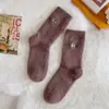 Calcetines blancos mujer otoño e invierno cálidos terciopelo de visón para dormir en casa calcetines de tubo medio de invierno divertidos de dibujos animados para mujer hogar
