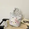 Bolso de mano Hello Kitty para mujer 2026 nuevo bolso tipo cubo de dibujos animados con un toque de alta gama, adecuado para ir al trabajo, bolso de hombro y cruzado de lunares