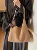 Bolso de axila nuevo para el día a día 2025 con textura simple, bolso de un solo hombro, bolso tipo cubo simple, bolso tote esmerilado para mujer