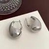 Brincos exagerados em forma de C de gota d'água vazados, transfronteiriços europeus e americanos, com sensação de luxo leve e alta qualidade, brincos da moda com design único