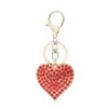 Llavero de corazón de diamantes completos coreano aleación de zinc amantes amor llavero de coche de aleación de zinc strass colgante para bolso de mujer venta al por mayor