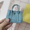 Nuevo Colgante de Mini Bolsa de Jardín Marca H Lindo Accesorio de Bolsa para Auriculares Cadena de Bolsa para Labiales de Microfibra Canasta de Verduras para Mujeres