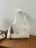 Bolso de axila de nicho estilo francés para mujer, nuevo bolso cruzado pequeño para teléfono móvil de moda primavera-verano 2026, bolso cruzado de hombro de alta gama